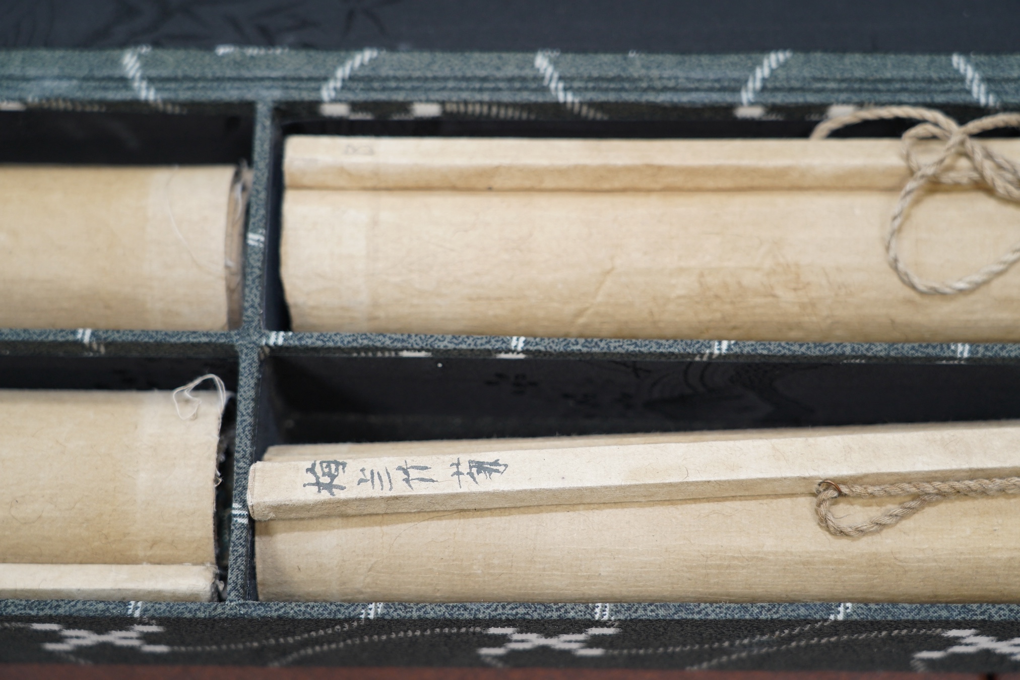 Chinese School, a set of four scroll paintings on paper of plum, orchid, bamboo and chrysanthemum, boxed. Condition - fair to good